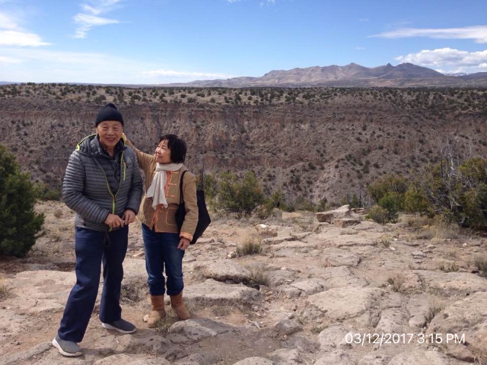Rae adjusting Shinn-Der's hair on a New Mexico hillside, March 2017
